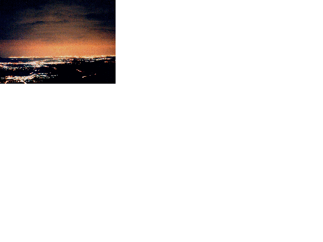 Globo de luz sobre madrid, visto desde el puerto de Los Leones